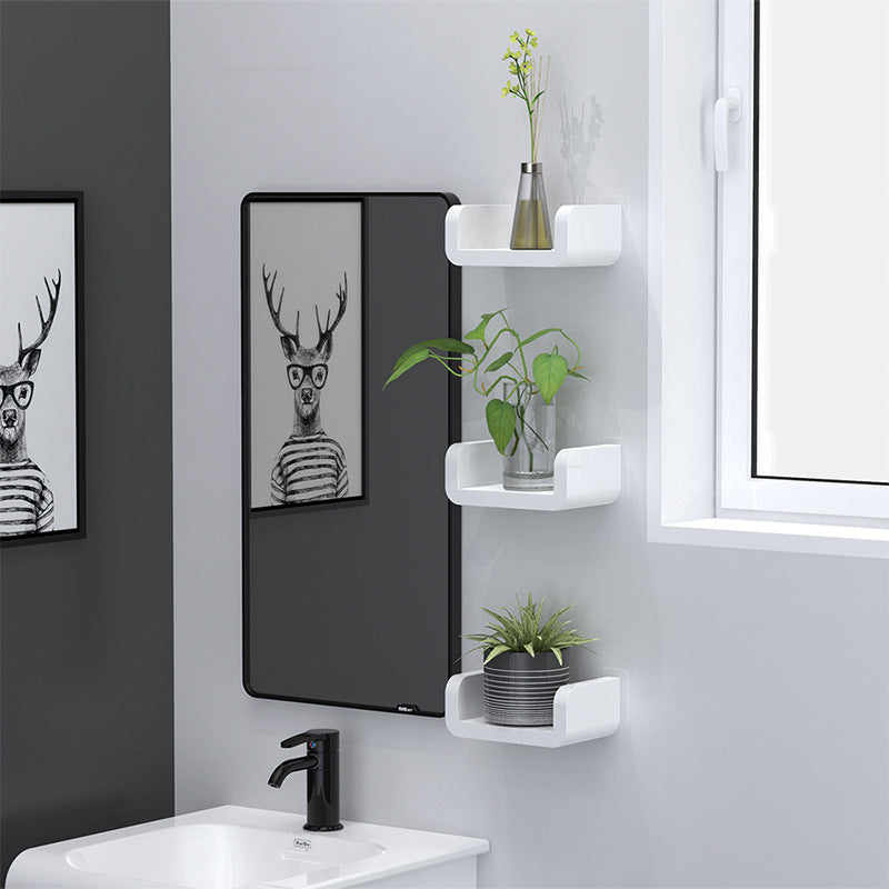 Suction cup bathroom shelf mounted near mirror