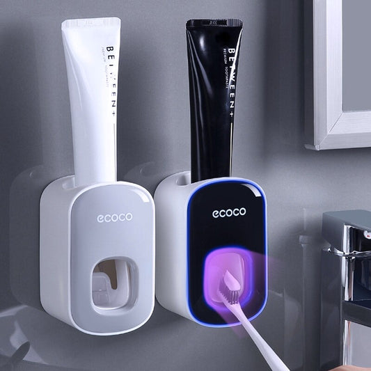 Toothpaste dispenser with double toothbrush cup holder