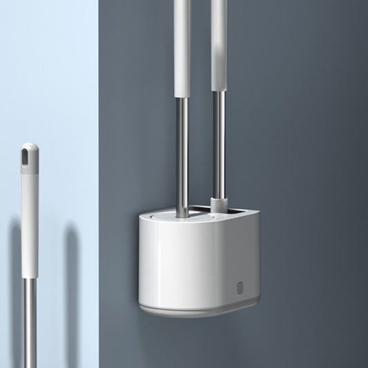 White TPR toilet brush set in floor standing style beside a toilet in a modern bathroom
