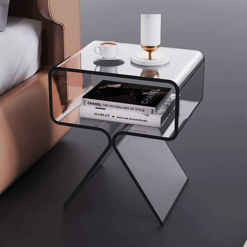 Transparent white acrylic side table beside a sofa in a minimalist living room
