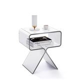 Smoked transparent black acrylic side table beside a dark sofa in a modern living room
