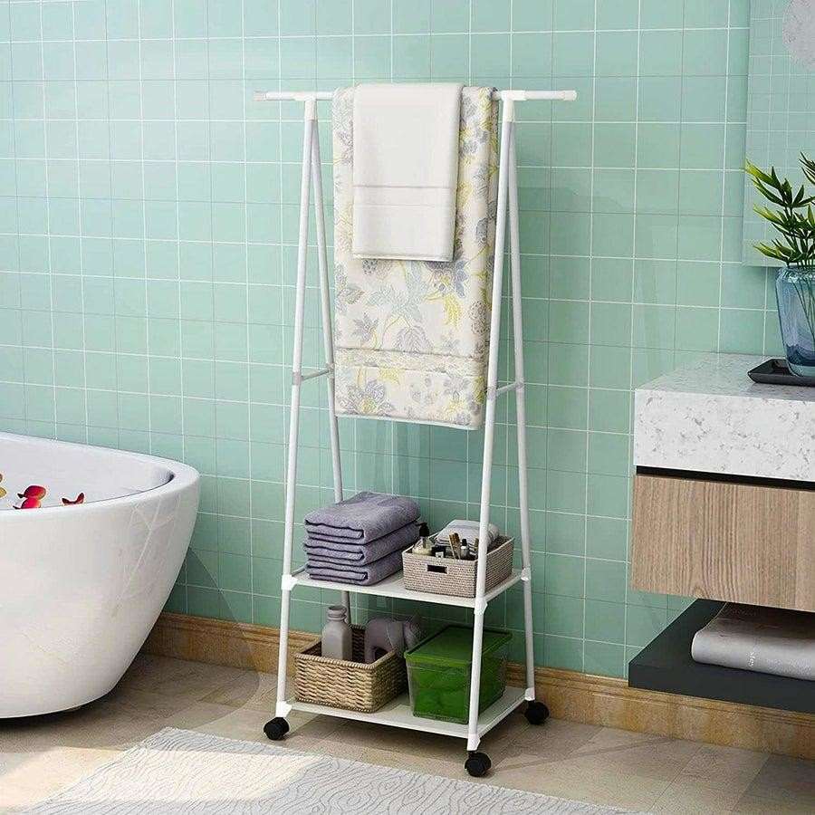 Triangle floor coat rack styled in bedroom with storage boxes