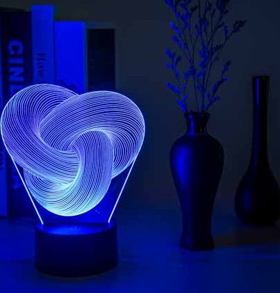 Twist abstract 3D LED night light in compact gift box packaging ready to give as a present
