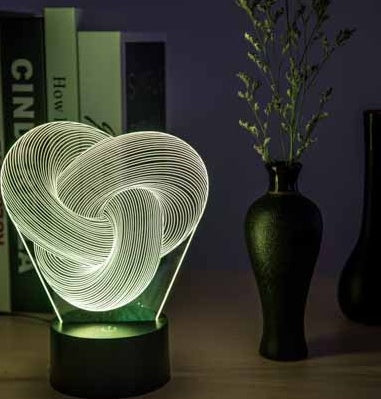 USB data cable plugged into the ABS base of the twist abstract 3D LED night light
