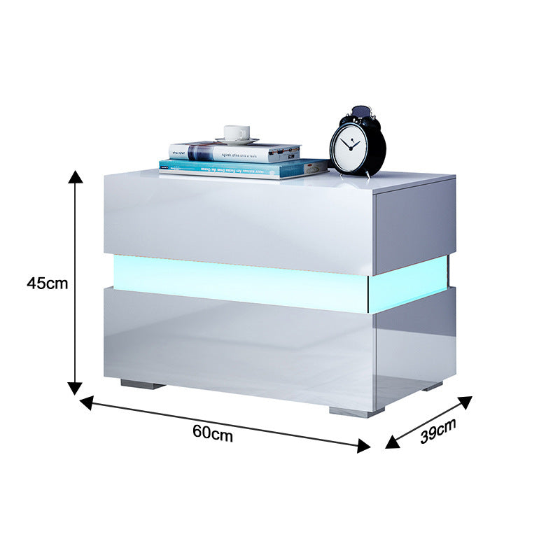 White two drawer bedside table showing different RGB LED color modes in a dark bedroom
