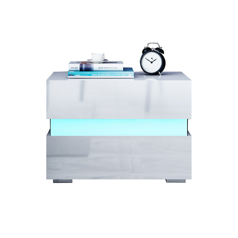 Flush drawer fronts on the white two drawer side table showing clean minimalist panel surface
