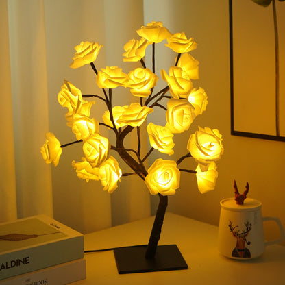 USB yellow rose tree lamp on bedroom nightstand