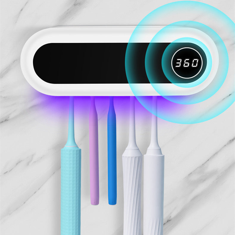 UV toothbrush disinfection shelf glowing purple during sterilization
