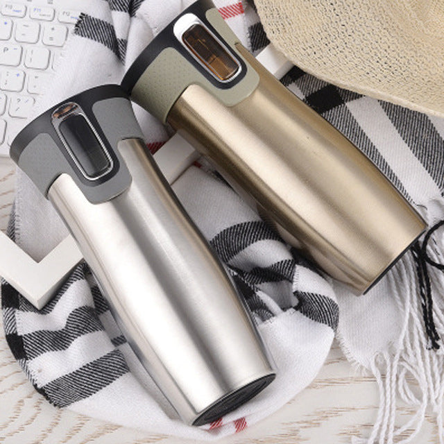 Vacuum insulated travel mug in gold finish