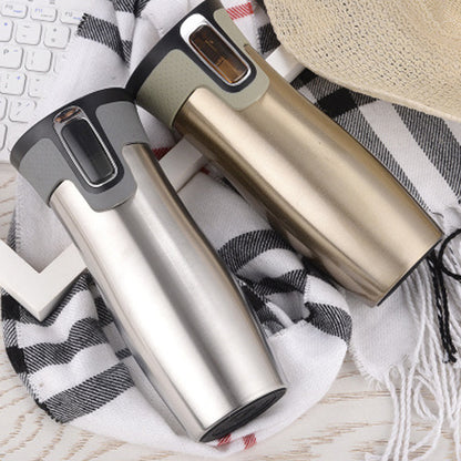 Vacuum insulated travel mug in gold finish