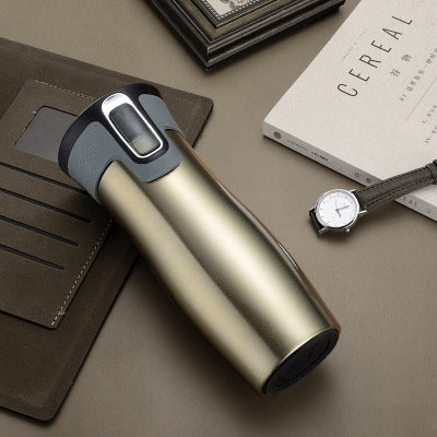 Vacuum insulated travel mug styled with accessories