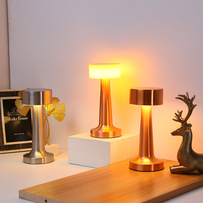 Vintage metal table lamps in rose gold bronze and space silver on desk