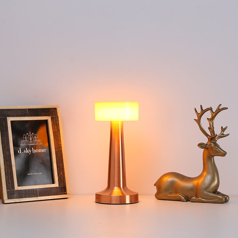 Vintage metal table lamp on bedroom nightstand with decor