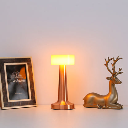 Vintage metal table lamp on bedroom nightstand with decor