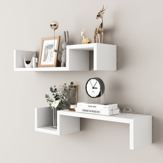 White single layer wall mounted decorative shelf above a bed in a modern bedroom