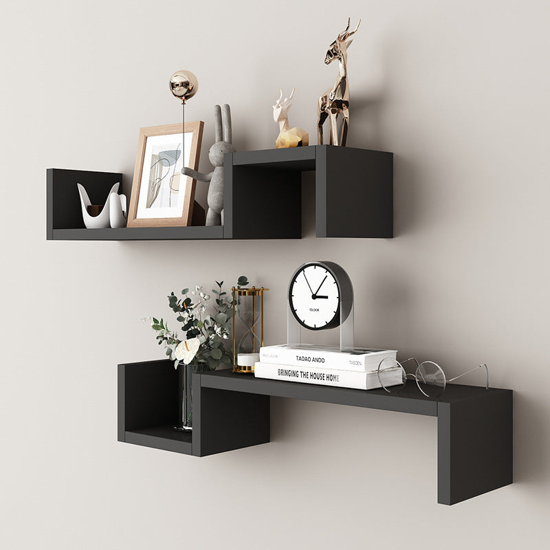 Wood tone single layer wall shelf on a warm-toned bedroom wall beside a window
