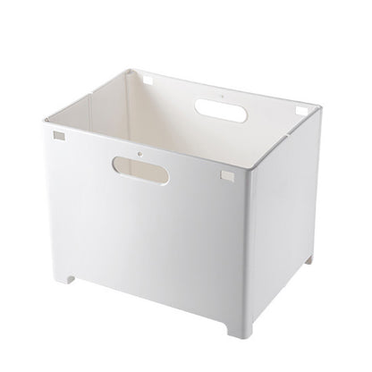 Bathroom floor completely clear with clothes stored in a white wall mounted hamper above
