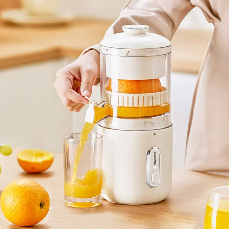 Hand pressing button on wireless portable electric juicer