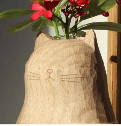 Empty handmade wooden cat vase with heart carving detail